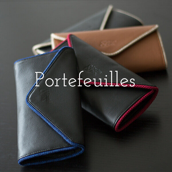 Portefeuilles – voir la collection. Portefeuilles en cuir noir et camel aux liserés colorés